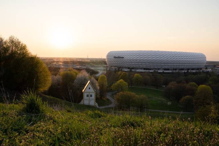 Allianz Arena in the north of Munich at sunset.